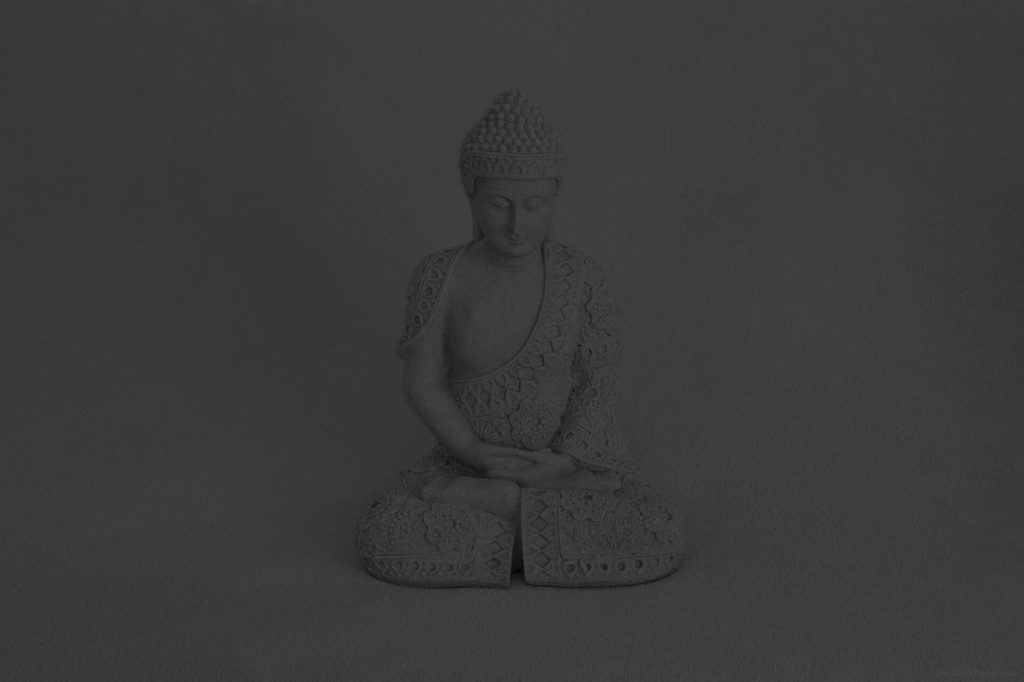 person meditating outdoors with calm breathing