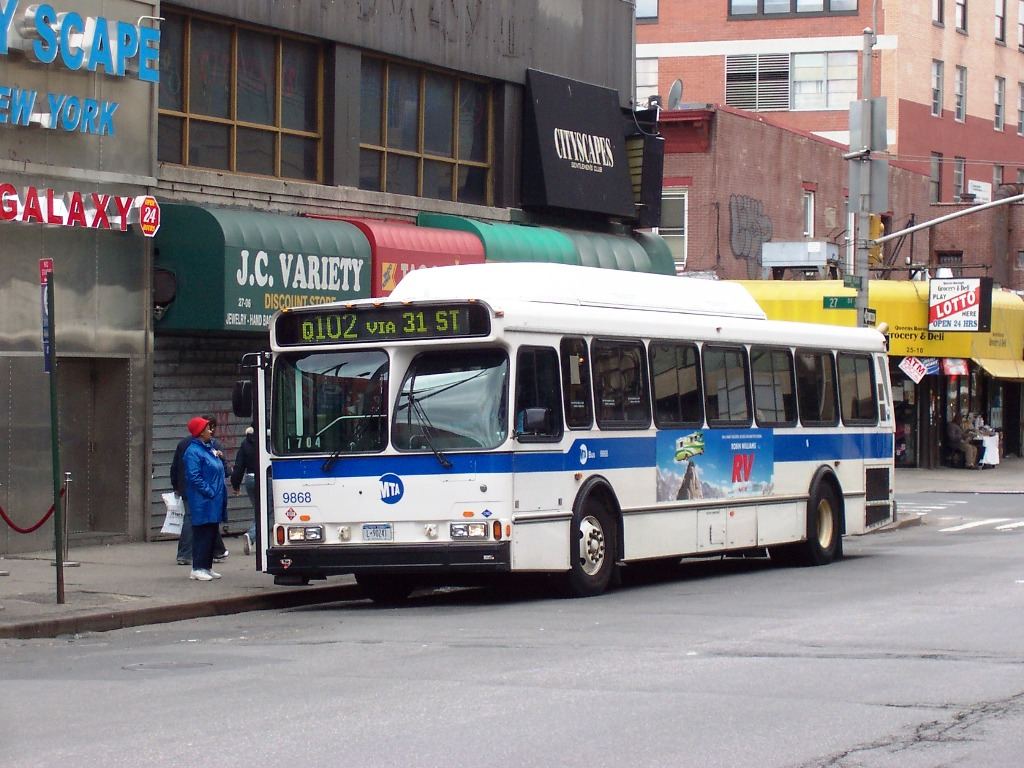 Riders Shift to Earlier Buses After Cities Publish Crowding Data passengers boarding a city bus on a busy street