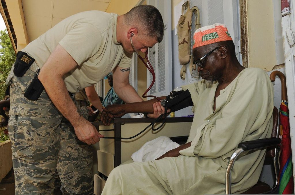 Walk-In Blood Pressure Checks Reach More Adults Early A nurse checking a patient's blood pressure with a cuff during a routine health appointment.