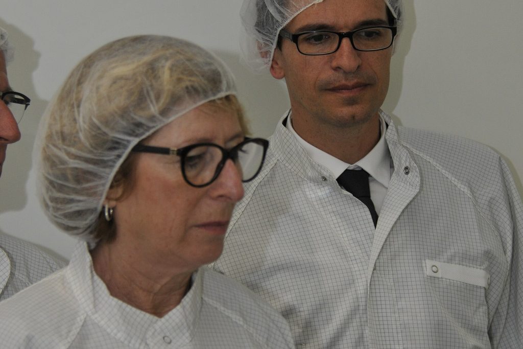 Semiconductor factory clean room with engineers producing computer chips